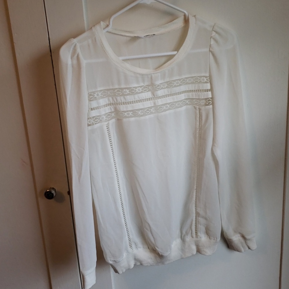Sheer blouse with lace detail across chest